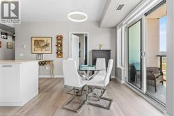 Dining area with light wood finished floors and baseboards - 