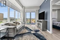 Living area with light wood finished floors and baseboards - 
