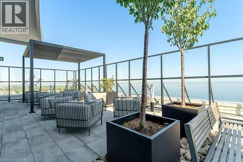 View of patio featuring a water view and an outdoor hangout area - 385 Winston Road Unit# 1402, Grimsby, ON - Outdoor With Body Of Water