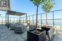 View of patio featuring a water view and an outdoor hangout area - 