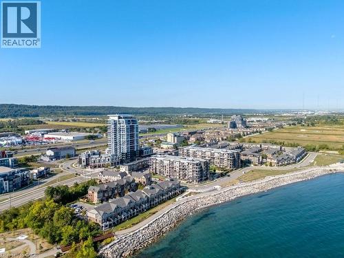 View of urban area featuring expansive beach - 385 Winston Road Unit# 1402, Grimsby, ON - Outdoor With Body Of Water With View