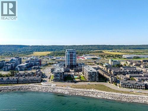 View of urban area featuring waterfront with a beach - 385 Winston Road Unit# 1402, Grimsby, ON - Outdoor With Body Of Water With View
