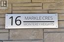 Modern address plaque featuring a brushed metal finish and black lettering, mounted on a stacked stone facade - 16 Markle Crescent Unit# 111, Ancaster, ON  -  