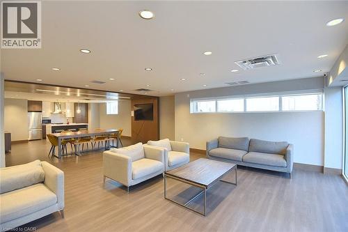 Open-concept common area featuring wood-finish flooring and recessed lighting - 16 Markle Crescent Unit# 111, Ancaster, ON - Indoor Photo Showing Other Room