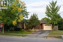 Obstructed view of property featuring brick siding, driveway, and an attached garage - 32 Donly Drive N, Simcoe, ON  - Outdoor 