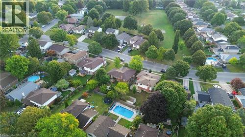 Aerial perspective of suburban area with a pool area - 32 Donly Drive N, Simcoe, ON - Outdoor With View