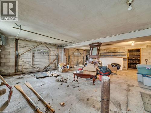 Spacious unfinished interior featuring concrete flooring and block wall construction - 1416 Highway 6, Hamilton, ON - Indoor Photo Showing Garage