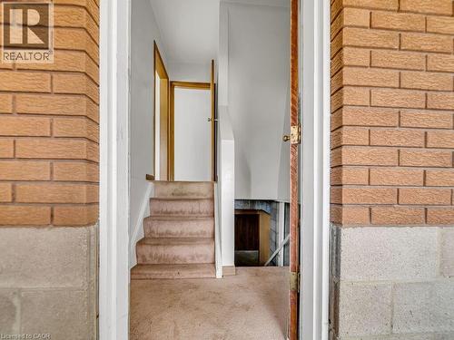 Brick exterior with a partial block foundation - 1416 Highway 6, Hamilton, ON - Indoor Photo Showing Other Room
