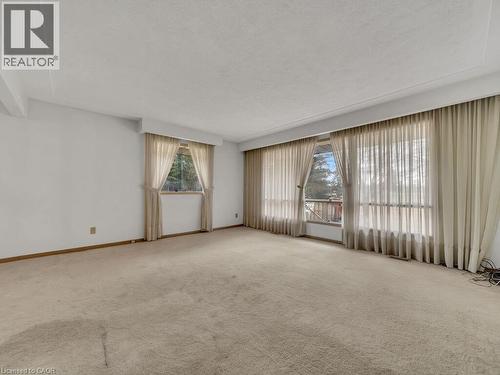 Bright room featuring light-toned carpeting and white walls - 1416 Highway 6, Hamilton, ON - Indoor Photo Showing Other Room