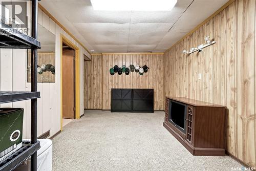 224 Mikkelson Drive, Regina, SK - Indoor Photo Showing Other Room With Fireplace