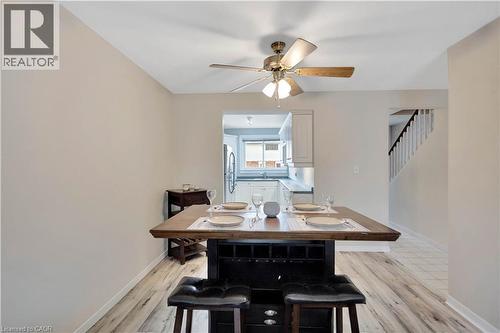 Kitchen featuring white cabinetry and light countertops - 32 Montclair Crescent, Simcoe, ON - Indoor