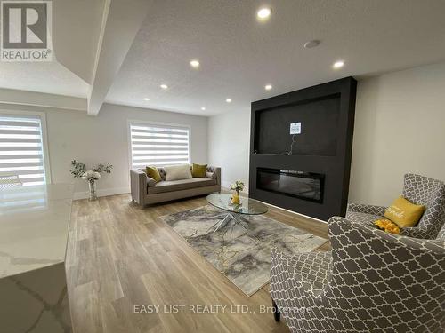 125 Steepleridge Street, Kitchener, ON - Indoor Photo Showing Living Room With Fireplace