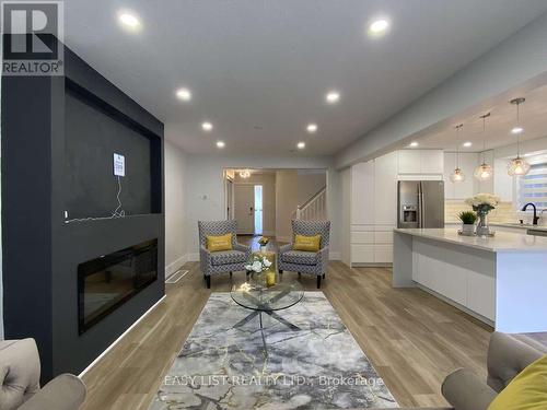 125 Steepleridge Street, Kitchener, ON - Indoor Photo Showing Living Room With Fireplace