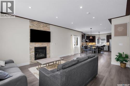 305 Clarence Avenue S, Saskatoon, SK - Indoor Photo Showing Living Room With Fireplace
