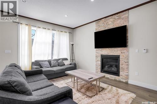 305 Clarence Avenue S, Saskatoon, SK - Indoor Photo Showing Living Room With Fireplace