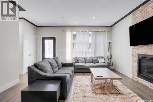 305 Clarence Avenue S, Saskatoon, SK - Indoor Photo Showing Living Room With Fireplace