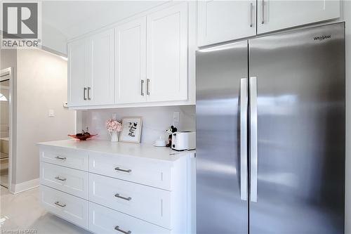 Stainless steel French door refrigerator set within white shaker cabinetry - 103 East 45Th Street, Hamilton, ON - Indoor Photo Showing Kitchen