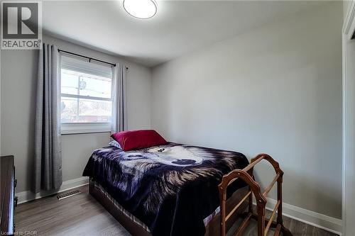 Room featuring light gray walls, a single window with white trim, and light wood-finish flooring - 103 East 45Th Street, Hamilton, ON - Indoor Photo Showing Bedroom
