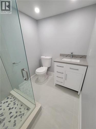 Contemporary bathroom featuring a glass-enclosed shower with mosaic tile flooring - 168 Garside Avenue N, Hamilton, ON - Indoor Photo Showing Bathroom