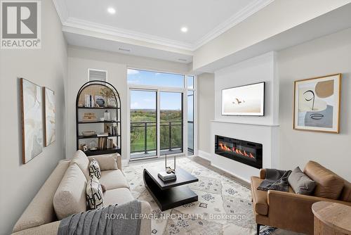 Up32 - 50 Herrick Avenue, St. Catharines (Oakdale), ON - Indoor Photo Showing Living Room With Fireplace