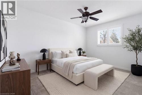 Bedroom featuring light grey carpeting, white walls, and a multi-speed ceiling fan - 341 Rexford Drive, Hamilton, ON - Indoor Photo Showing Bedroom