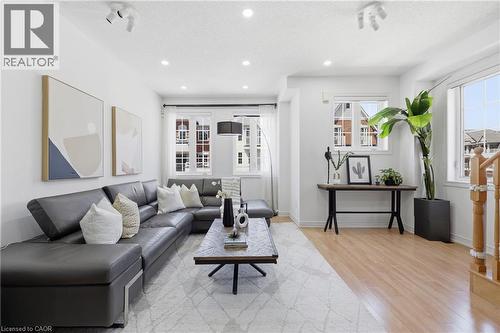 Open-concept living space featuring recessed lighting, track lighting, and multiple windows - 9 Rabbit Run Way, Brampton, ON - Indoor Photo Showing Living Room