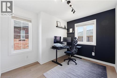 Bright room featuring light wood-finish flooring and a contrasting accent wall - 9 Rabbit Run Way, Brampton, ON - Indoor Photo Showing Office