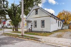 Light-colored siding exterior with a dark trim accent - 