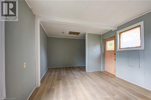 Bedroom 1 featuring light wood-finish flooring and light gray walls - 1 Rathgar Street, London, ON - Indoor Photo Showing Other Room