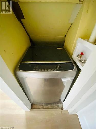 Dedicated laundry area with light wood-finish flooring - 1 Rathgar Street, London, ON - Indoor Photo Showing Other Room