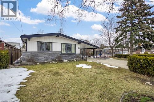 Contemporary home featuring a stone facade, white siding, and dark trim - 85 Ranchdale Drive, Hamilton, ON - Outdoor