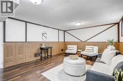 Finished lower level space featuring wood-finish flooring - 