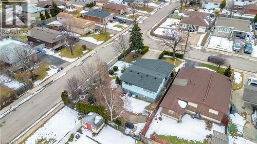 Aerial perspective showcasing a residential neighborhood with detached homes, paved streets, and established trees - 85 Ranchdale Drive, Hamilton, ON - Outdoor With View