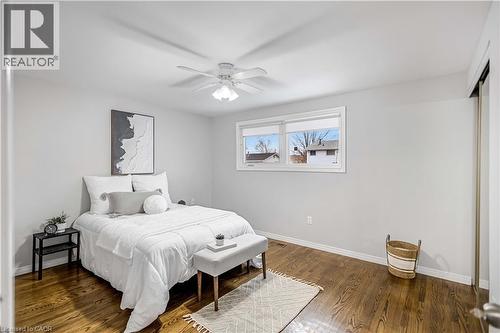 Hardwood-finish flooring enhancing the bright bedroom space - 85 Ranchdale Drive, Hamilton, ON 