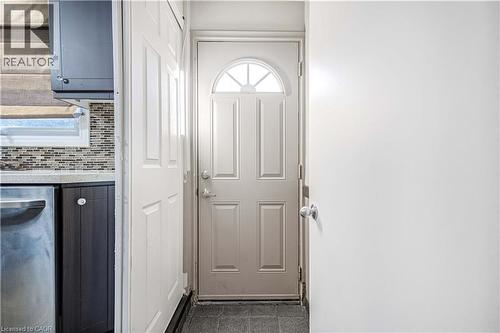 Entry door featuring an arched transom window - 85 Ranchdale Drive, Hamilton, ON 
