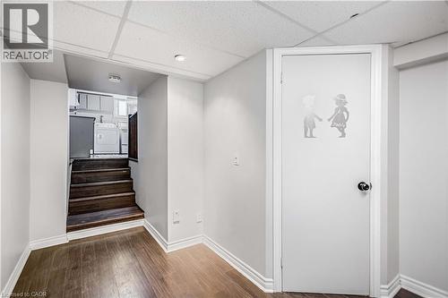 Finished lower-level space featuring wood-finish flooring, recessed lighting, and white trim - 85 Ranchdale Drive, Hamilton, ON 