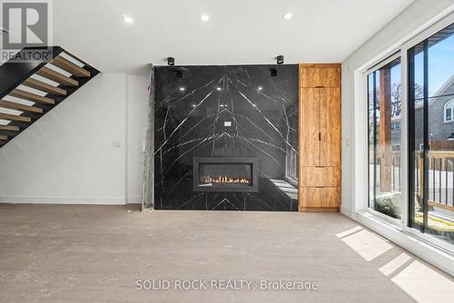 828 Alpine Avenue, Ottawa, ON - Indoor Photo Showing Other Room With Fireplace