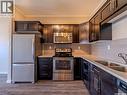102 720 Baltzan Boulevard, Saskatoon, SK  - Indoor Photo Showing Kitchen With Double Sink 