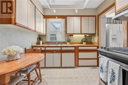 257 Queensdale Avenue E, Hamilton, ON - Indoor Photo Showing Kitchen With Double Sink