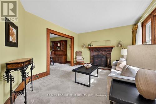 257 Queensdale Avenue E, Hamilton, ON - Indoor Photo Showing Living Room With Fireplace