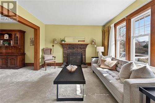257 Queensdale Avenue E, Hamilton, ON - Indoor Photo Showing Living Room With Fireplace
