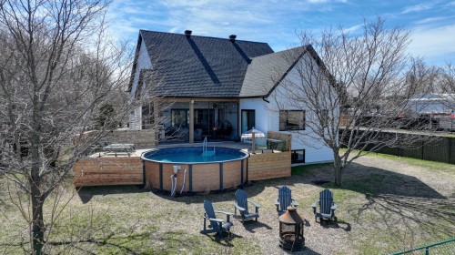 Face arrière - 2582 Ch. Bellerive, Carignan, QC - Outdoor With Above Ground Pool