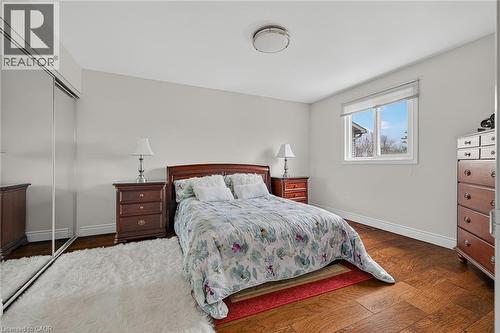 Spacious room featuring wood-finish flooring, a large window, and light-toned walls - 79 Holbrook Crescent, Cambridge, ON - Indoor Photo Showing Bedroom