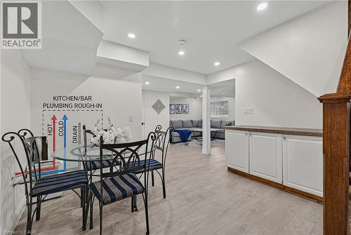 Finished lower level featuring recessed lighting, light wood-finish flooring, and crisp white walls - 79 Holbrook Crescent, Cambridge, ON - Indoor Photo Showing Dining Room