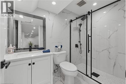 Modern bathroom featuring white marble-look wall and floor tiling - 79 Holbrook Crescent, Cambridge, ON - Indoor Photo Showing Bathroom