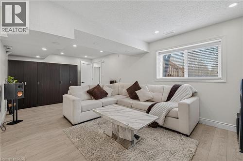Spacious living area featuring light wood-finish flooring and recessed lighting - 79 Holbrook Crescent, Cambridge, ON - Indoor Photo Showing Living Room