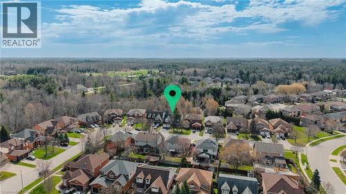 Aerial perspective highlighting a residential community with varied architectural styles and mature landscaping - 79 Holbrook Crescent, Cambridge, ON - Outdoor With View