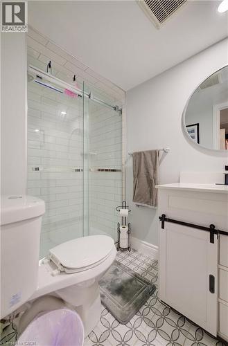 Shower featuring subway tile surround and clear glass sliding door - 172 Rennie Drive, Kitchener, ON - Indoor Photo Showing Bathroom