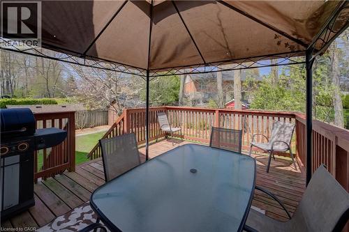Expansive wood deck with a built-in privacy railing, providing direct access to the lawn - 172 Rennie Drive, Kitchener, ON - Outdoor With Deck Patio Veranda With Exterior