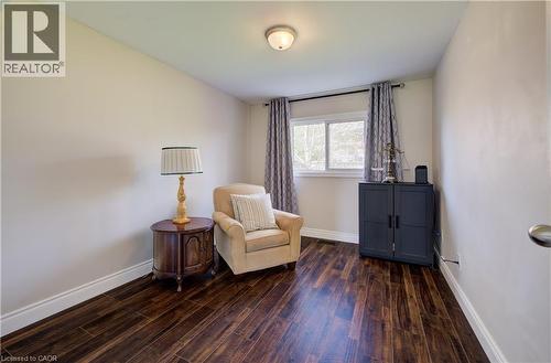 Interior room featuring dark wood-finish flooring, white baseboards, and neutral wall paint - 172 Rennie Drive, Kitchener, ON - Indoor